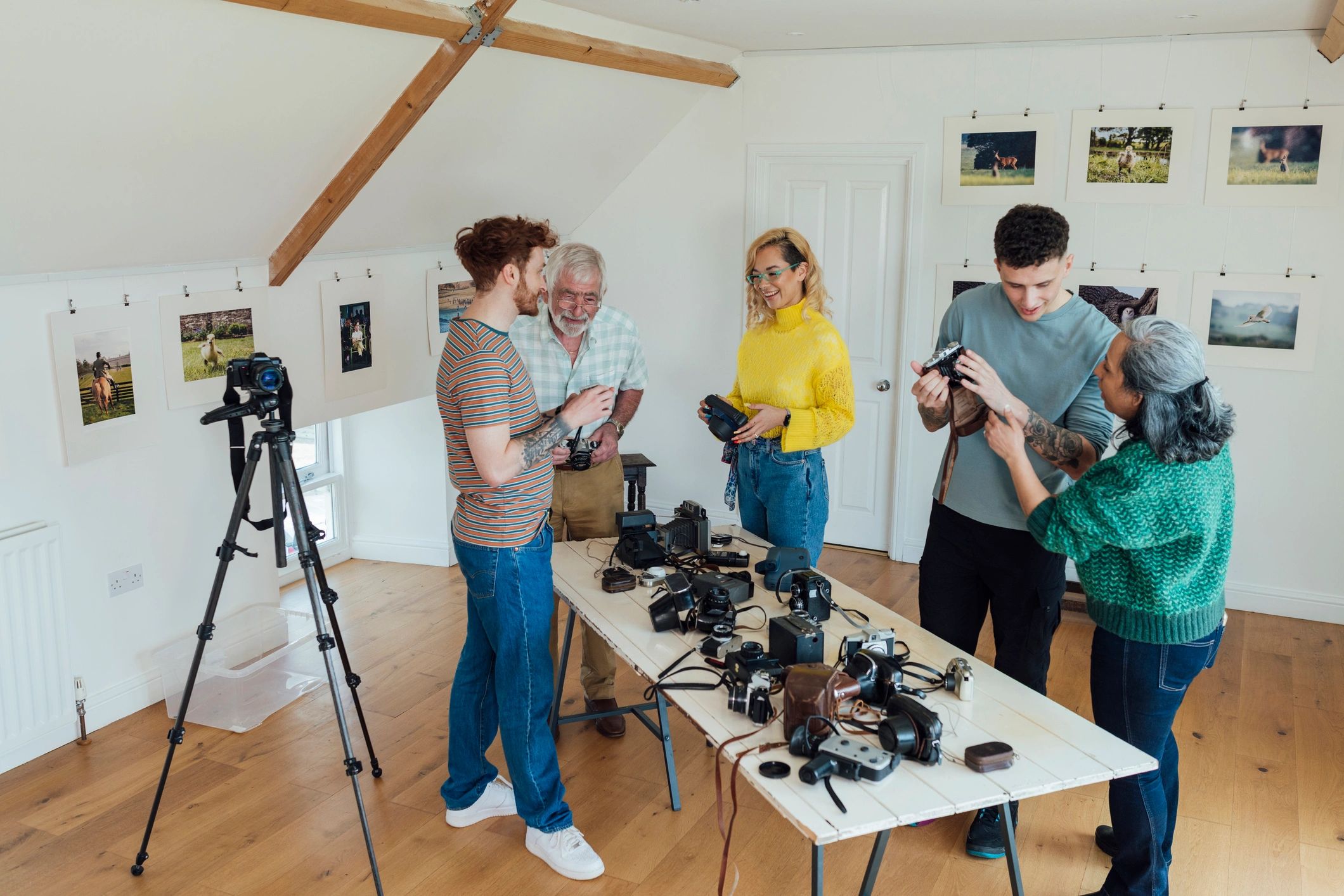 Video production team reviewing cameras in a creative studio